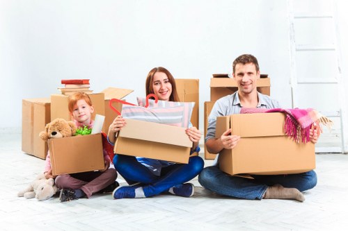 Removal van and packed boxes for a home move in Upton