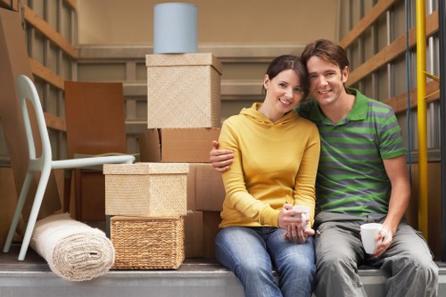 Household furniture being carried through a Upton property