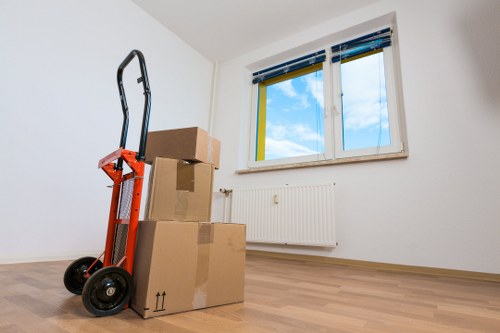 Packed boxes and household items arranged in a moving truck